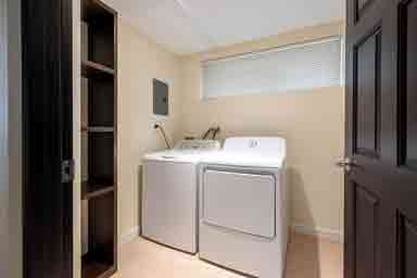 Orchid III washer and dryer area